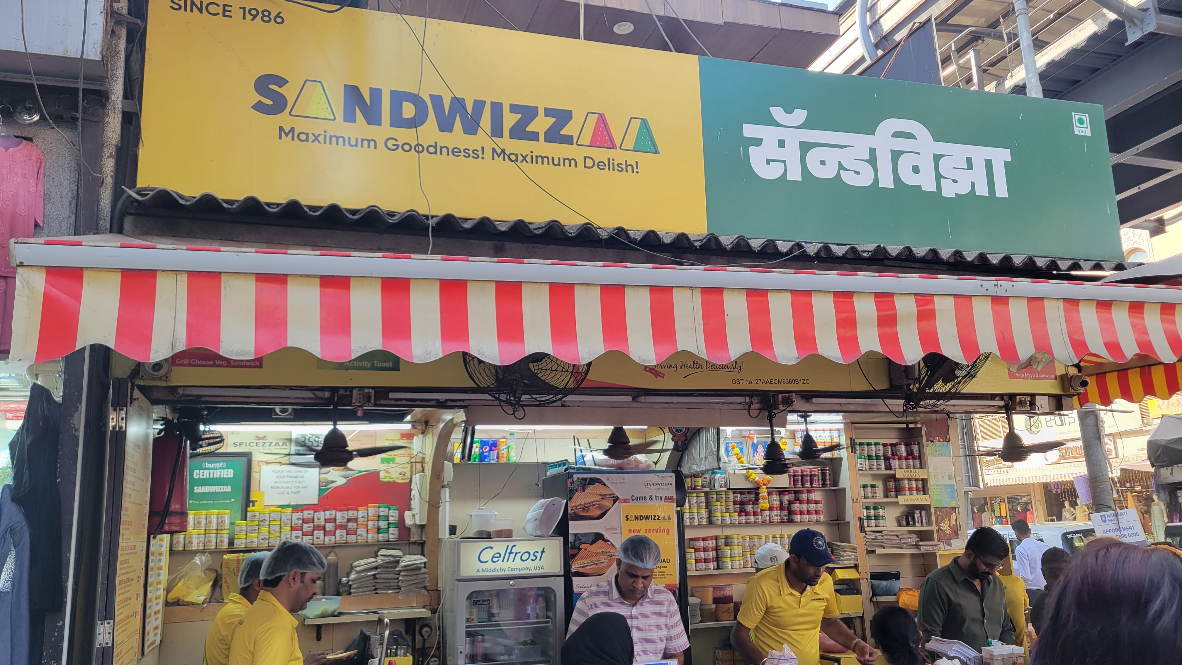 A bustling store in Mumbai that sells sandwiches.
